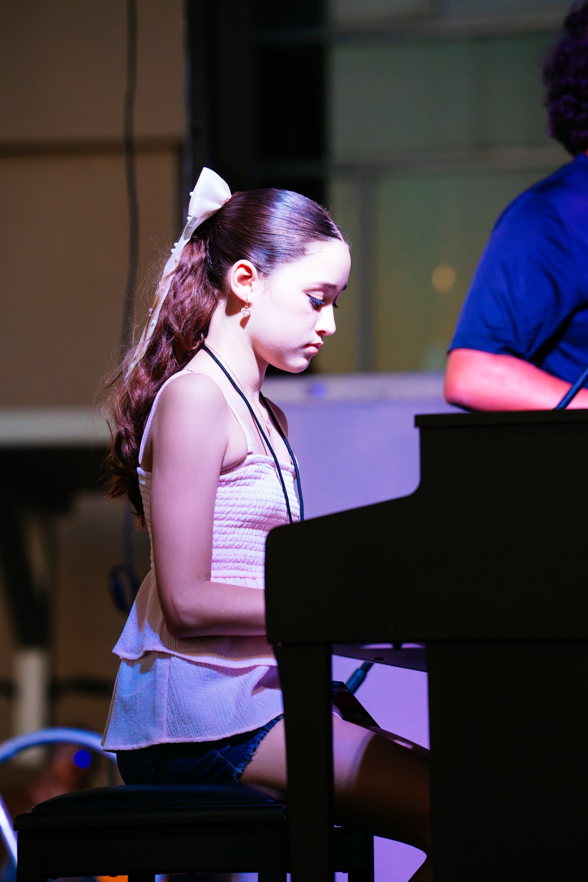 Ava Neeley performing piano during the evening program