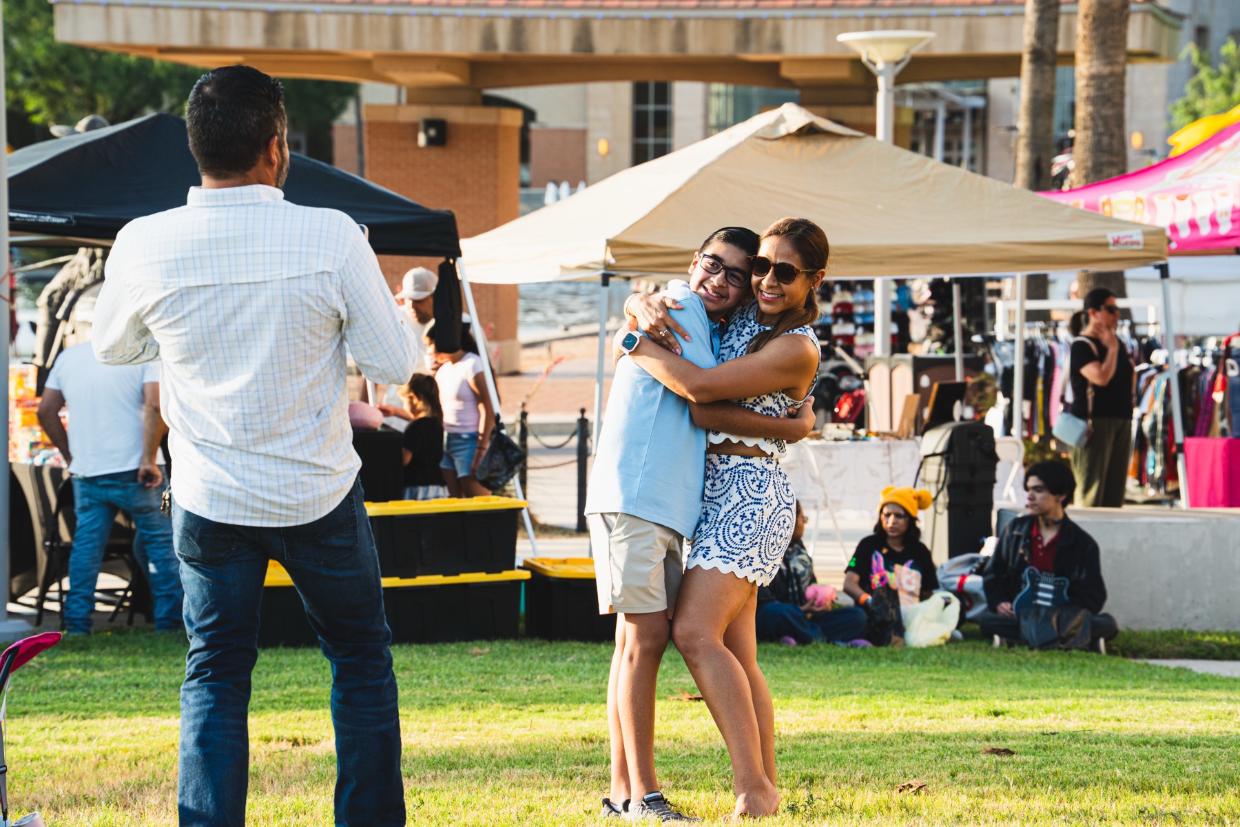 Festival attendees dancing together on the lawn