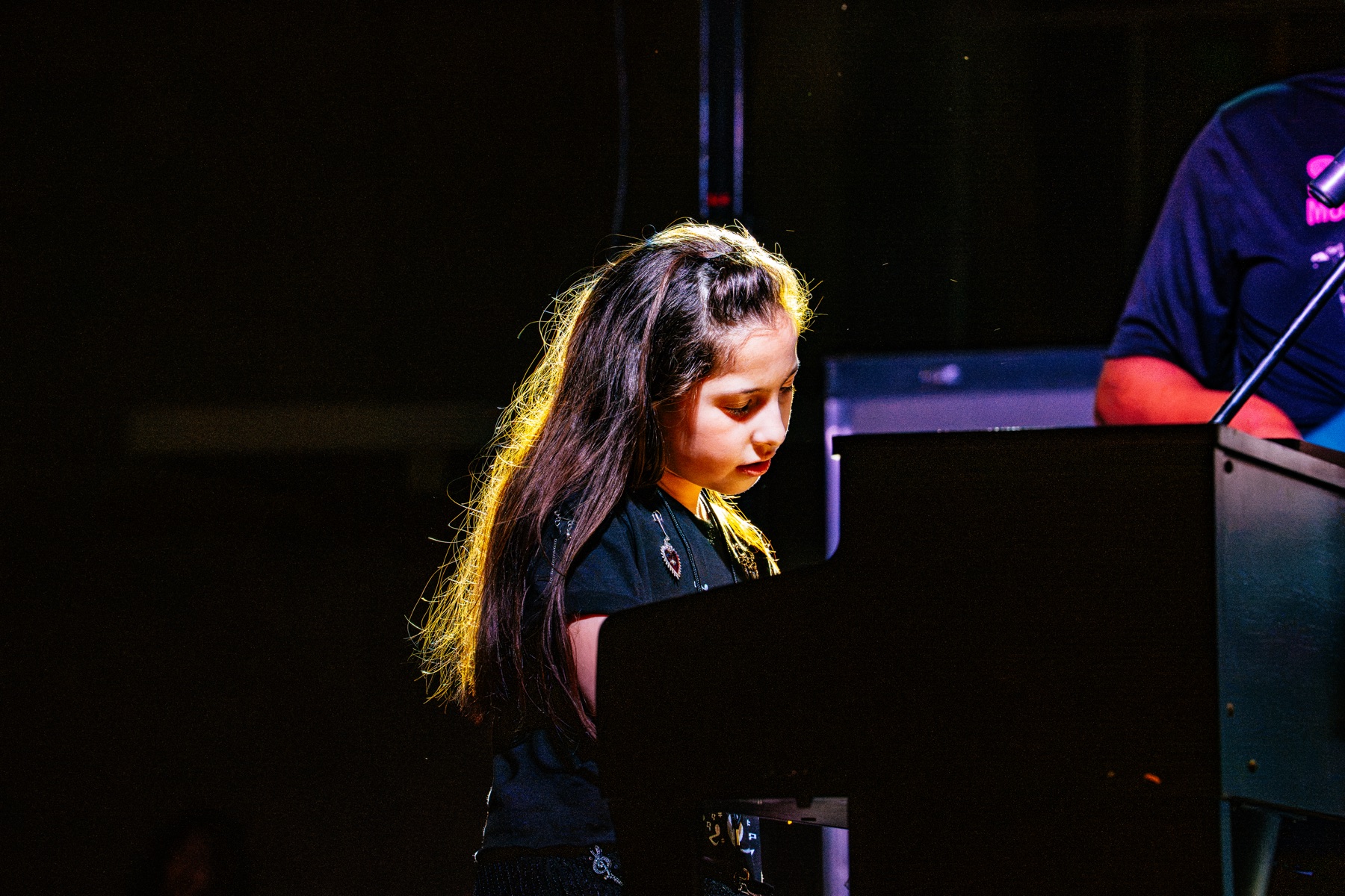 Grecia Sibaja performing piano onstage