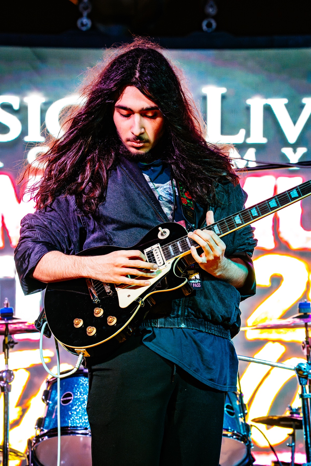 Noah Sanchez performing electric guitar onstage